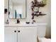 Stylish bathroom with a modern vanity, black fixtures, and sleek shelving for storage at 3350 Brookfield Dr, Holiday, FL 34691