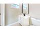 Clean bathroom features a sleek vanity with a black faucet, toilet, and a mirror at 3350 Brookfield Dr, Holiday, FL 34691