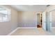 Spacious bedroom with tile floors, neutral walls, and a closet with sliding doors at 3350 Brookfield Dr, Holiday, FL 34691