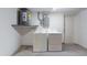 Functional laundry area with modern washer and dryer units, and utility access at 3350 Brookfield Dr, Holiday, FL 34691