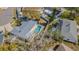 This aerial view highlights the backyard pool and screened patio of this single-Gathering home at 3704 Thornwood Pl, Tampa, FL 33618