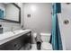 This bathroom includes vanity storage and a shower at 3704 Thornwood Pl, Tampa, FL 33618