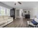 Bright living room with gray walls, modern flooring, and comfortable seating at 3704 Thornwood Pl, Tampa, FL 33618