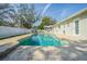 Stunning in-ground pool with a paved deck, offering a perfect outdoor oasis at 3704 Thornwood Pl, Tampa, FL 33618