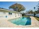 Beautiful in-ground pool featuring a paved deck, perfect for outdoor enjoyment and entertaining at 3704 Thornwood Pl, Tampa, FL 33618