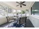 Light-filled sunroom features a ceiling fan, and multiple windows providing an airy atmosphere at 3704 Thornwood Pl, Tampa, FL 33618