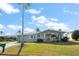 Charming single-story home featuring a well-manicured lawn and inviting front entrance at 3832 Star Island Dr, Holiday, FL 34691