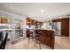 Modern kitchen featuring island with bar seating and stainless refrigerator at 3832 Star Island Dr, Holiday, FL 34691