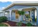 Inviting front porch featuring decorative chairs and a well-maintained exterior at 3832 Star Island Dr, Holiday, FL 34691