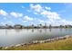 Waterfront view from backyard showcasing a calm canal and lush landscaping at 3832 Star Island Dr, Holiday, FL 34691