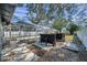 Outdoor bar with seating, adjacent to screened pool at 4412 W Pearl Ave, Tampa, FL 33611