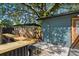 Wooden outdoor bar with seating and shower nearby at 4412 W Pearl Ave, Tampa, FL 33611