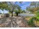 Backyard with shed and mature trees offering ample space at 4412 W Pearl Ave, Tampa, FL 33611