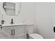 Updated bathroom with white vanity, black fixtures, and a stylish mirror at 4412 W Pearl Ave, Tampa, FL 33611