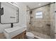 Clean bathroom, featuring a walk-in shower and updated fixtures at 4412 W Pearl Ave, Tampa, FL 33611