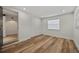 Spacious bedroom with wood-look floors and an open doorway at 4412 W Pearl Ave, Tampa, FL 33611