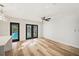 Light-filled dining area with French doors opening to a backyard pool at 4412 W Pearl Ave, Tampa, FL 33611