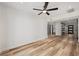 Spacious living room with wood-look floors and ceiling fan at 4412 W Pearl Ave, Tampa, FL 33611