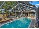 Refreshing screened pool with ample space for relaxation at 4412 W Pearl Ave, Tampa, FL 33611