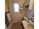 The bathroom features a vanity and shower, and a window for natural light at 4425 Autumn Palm Dr, Zephyrhills, FL 33542