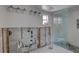 Bathroom with a large shower that features glass doors and mosaic tile at 4440 Huntington Ne St, St Petersburg, FL 33703