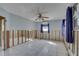 Bedroom needing renovation with natural light and ceiling fan at 4440 Huntington Ne St, St Petersburg, FL 33703