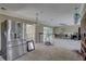 View of kitchen with a stainless steel refrigerator needing renovations and repairs at 4440 Huntington Ne St, St Petersburg, FL 33703