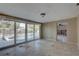 Bright living area with sliding glass doors to a pool, and tile floors awaiting renovation at 4440 Huntington Ne St, St Petersburg, FL 33703