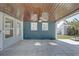 Covered patio with a wood ceiling, fan, and tile flooring for outdoor living at 4440 Huntington Ne St, St Petersburg, FL 33703