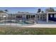 Pool and patio area of house surrounded by safety fence at 4440 Huntington Ne St, St Petersburg, FL 33703