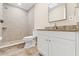 Bathroom features a stand-up shower, modern vanity, and complementary neutral tiling at 4472 Bayridge Ct, Spring Hill, FL 34606