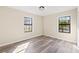 Bedroom featuring plenty of natural light from the two windows at 4472 Bayridge Ct, Spring Hill, FL 34606