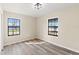 Bedroom with natural light streaming through two windows at 4472 Bayridge Ct, Spring Hill, FL 34606