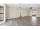 Bright living room featuring stylish ceiling fans and durable, attractive wood-look floors at 4472 Bayridge Ct, Spring Hill, FL 34606