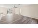 Bright living room with new floors, fan, and large bay window at 4472 Bayridge Ct, Spring Hill, FL 34606