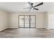 Living room with sliding doors and natural lighting at 4472 Bayridge Ct, Spring Hill, FL 34606