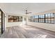 Bright sunroom with modern ceiling fan, and abundant windows providing natural light at 4472 Bayridge Ct, Spring Hill, FL 34606