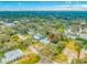 Aerial view of the neighborhood featuring tree-lined streets and homes, offering a glimpse into the community's setting and layout at 4636 W Longfellow Ave, Tampa, FL 33629