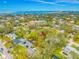 Residential neighborhood with lush green trees and serene bay views under a partly cloudy sky at 4636 W Longfellow Ave, Tampa, FL 33629