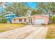 Charming single-story home with an attached garage, well-maintained lawn, and cozy curb appeal enhancing the property's value at 4636 W Longfellow Ave, Tampa, FL 33629