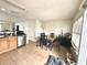 Dining area adjacent to kitchen with glass-top table and chairs at 4883 Tuscan Loon Dr, Tampa, FL 33619