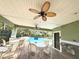 Community pool area with covered seating and ceiling fans at 4883 Tuscan Loon Dr, Tampa, FL 33619