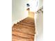 Modern stairs with wood-look laminate flooring at 4883 Tuscan Loon Dr, Tampa, FL 33619