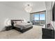 Luxurious bedroom with a king-size bed and water views at 5120 Marina Way # 14002, Tampa, FL 33611