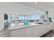 Modern kitchen island with white cabinets and stunning water views at 5120 Marina Way # 14002, Tampa, FL 33611