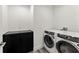 Bright laundry room featuring a washer and dryer at 5120 Marina Way # 14002, Tampa, FL 33611