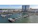 Aerial view of a marina with many boats and a high rise building in the background at 5120 Marina Way # 14002, Tampa, FL 33611