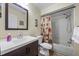 Bright bathroom featuring a shower-tub combo and a modern vanity with a stylish mirror at 5265 E Bay Dr # 424, Clearwater, FL 33764