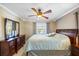 Comfortable bedroom with a queen bed, dresser, and soft natural light at 5265 E Bay Dr # 424, Clearwater, FL 33764