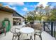 Community outdoor patio with tables, chairs, and a grill for resident gatherings at 5265 E Bay Dr # 424, Clearwater, FL 33764